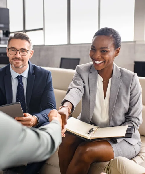 Business people shaking hands during meeting